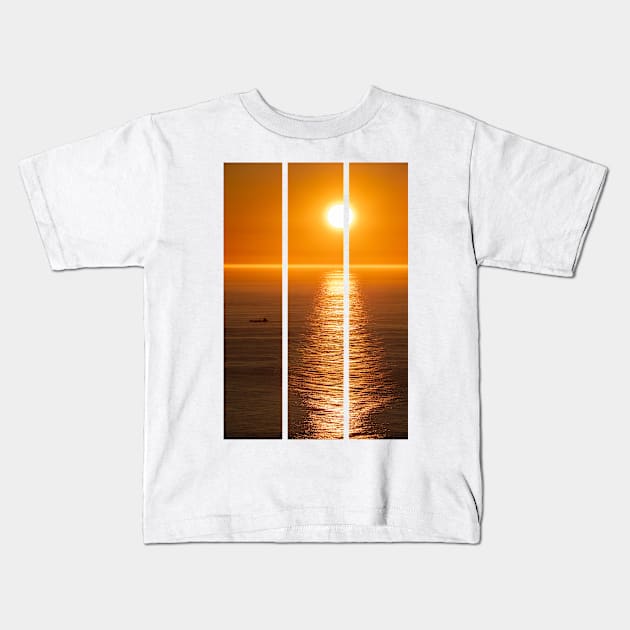 Wonderful landscapes in Norway. Nord-Norge. Beautiful scenery of a midnight sun sunset at Nordkapp (Cape North). Boat and globe on a cliff. Rippled sea and clear orange sky. (vertical) Kids T-Shirt by fabbroni-art